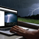 **Image Prompt:** A person calmly using a laptop connected to a UPS during a thunderstorm with a power outage. Focus on the feeling of security and preparedness.